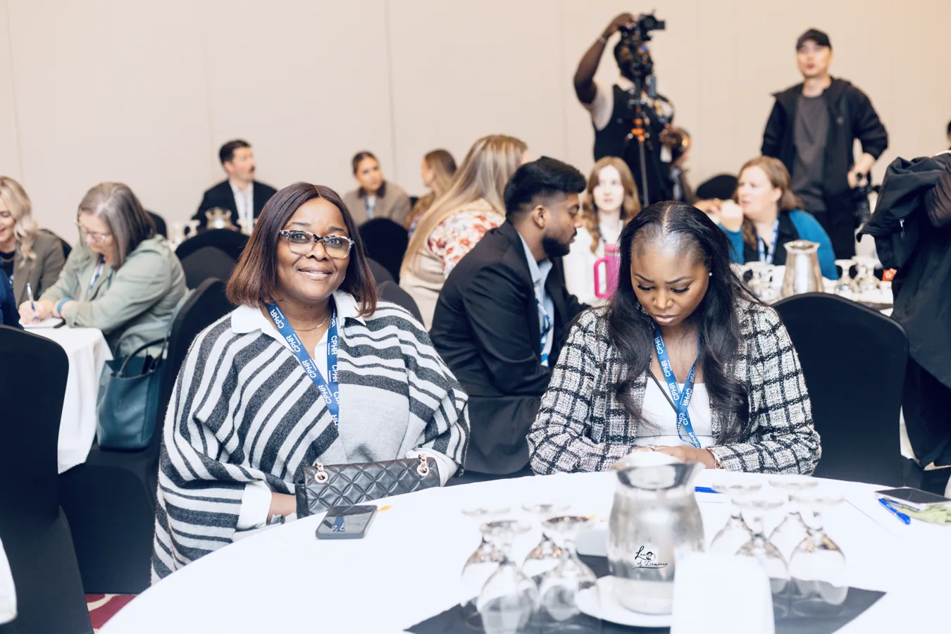 Participants smiling and discussing at a table